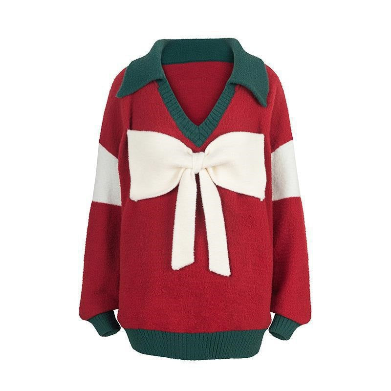 Rote Schleife gestrickte übergroße Weihnachtspullover